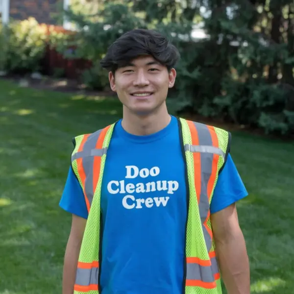 Doo Cleanup Crew team member serving a local yard